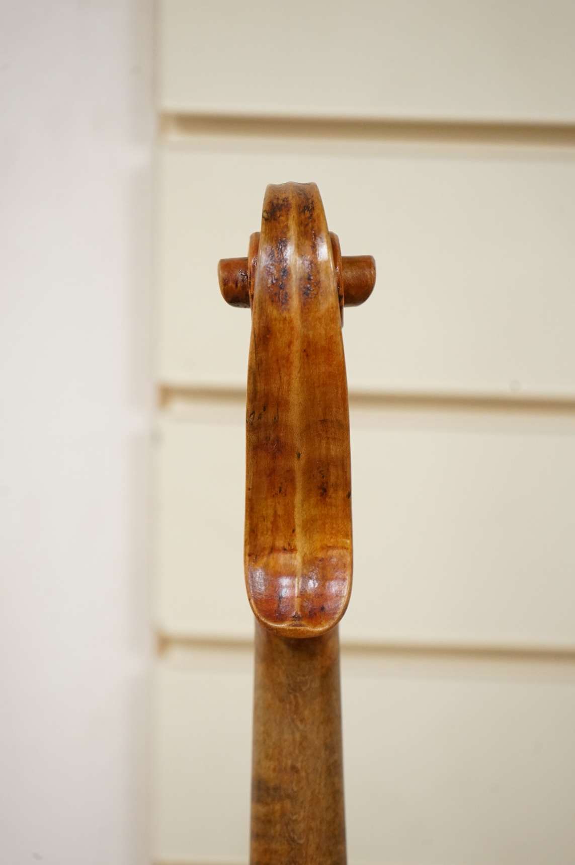 Three violins; a late 19th century German Stradivarius pattern violin, without label, a handmade violin (a.f.), with sound post crack, broken and repaired scroll, etc. and a Maidstone violin body, varnish stripped from t